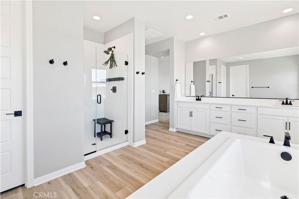 Bathroom, Dual Sink Vanities, Glass Shower, Interior, Recessed Lighting, Wood Texture Flooring