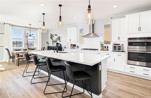 Dining room, Interior, Kitchen, Pendant Lights, Recessed Lighting, Stainless Steel Appliances, Wood Texture Flooring
