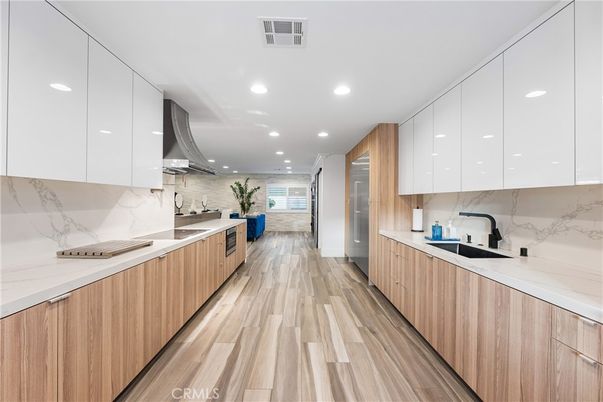 Interior, Kitchen, Marble Walls, Recessed Lighting, Stainless Steel Appliances, Wood Texture Flooring