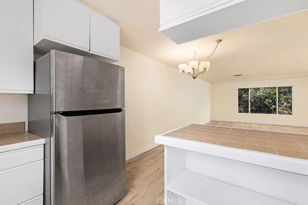 Chandelier, Interior, Kitchen, Tile Countertops, Wood Texture Flooring