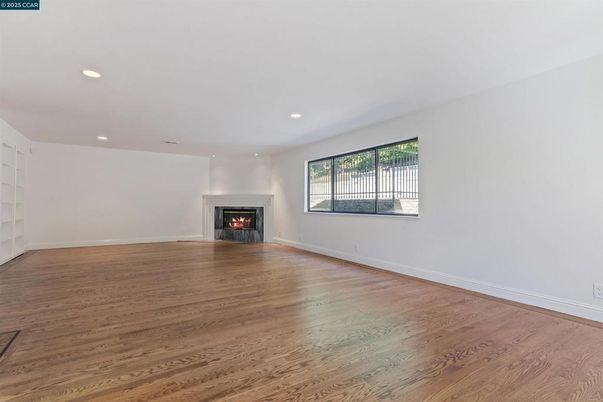 Empty room, Fireplace, Interior, Recessed Lighting, Wood Texture Flooring