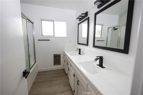 Bathroom, Dual Sink Vanities, Glass Shower, Interior, Tile Countertops, Wood Texture Flooring