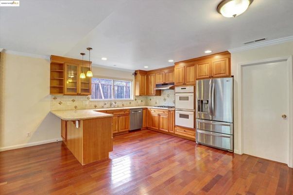 Interior, Kitchen, Pendant Lights, Recessed Lighting, Stainless Steel Appliances, Wood Texture Flooring