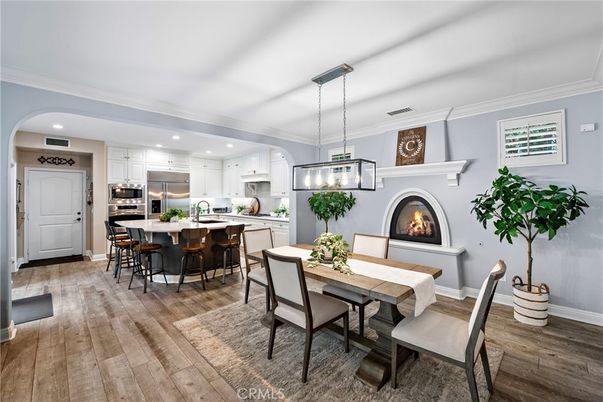 Dining room, Fireplace, Interior, Kitchen, Pendant Lights, Recessed Lighting, Stainless Steel Appliances, Wood Texture Flooring