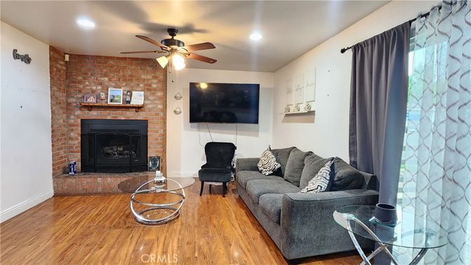 Fireplace, Interior, Living room, Recessed Lighting, Stone Walls, Wood Texture Flooring