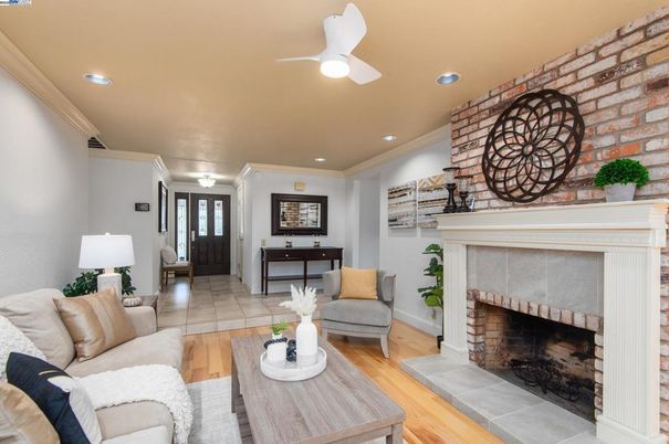 Fireplace, Interior, Living room, Recessed Lighting, Stone Walls, Wood Texture Flooring