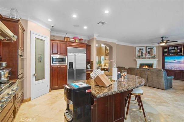 Fireplace, Interior, Kitchen, Living room, Recessed Lighting, Stainless Steel Appliances