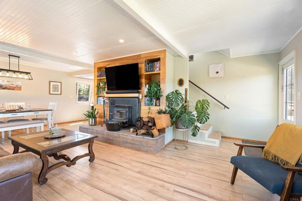Dining room, Fireplace, Interior, Living room, Pendant Lights, Recessed Lighting, Wood Texture Flooring