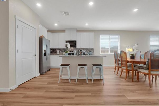 Dining room, Interior, Kitchen, Recessed Lighting, Stainless Steel Appliances, Wood Texture Flooring