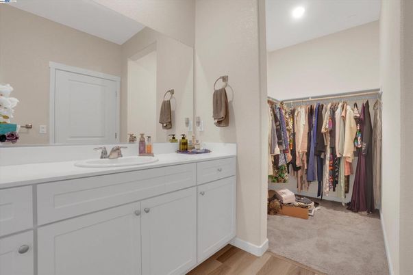 Bathroom, Dual Sink Vanities, Interior, Recessed Lighting, Walk-in Closets, Wood Texture Flooring