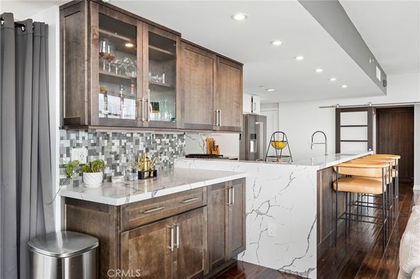 Interior, Kitchen, Marble Walls, Recessed Lighting, Stainless Steel Appliances, Wood Texture Flooring