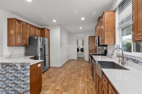 Interior, Kitchen, Recessed Lighting, Washer, Wood Texture Flooring