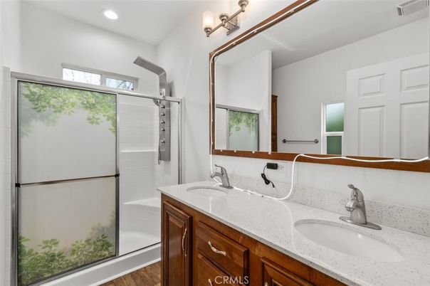 Bathroom, Dual Sink Vanities, Interior, Recessed Lighting, Wood Texture Flooring