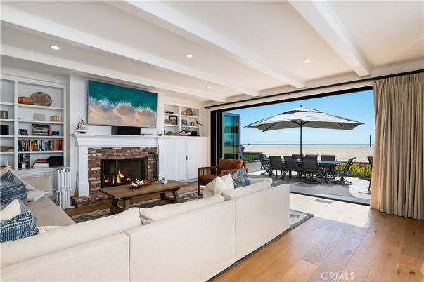 Dining room, Fireplace, Interior, Living room, Recessed Lighting, Water, Wood Texture Flooring