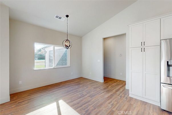 Empty room, Interior, Kitchen, Pendant Lights, Stainless Steel Appliances, Wood Texture Flooring