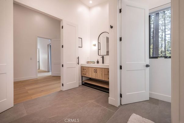 Bathroom, Dual Sink Vanities, Interior, Recessed Lighting, Wood Texture Flooring