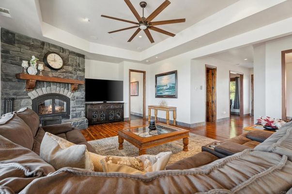 Fireplace, Interior, Living room, Recessed Lighting, Stone Walls, Wood Texture Flooring
