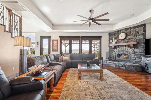 Fireplace, Interior, Living room, Recessed Lighting, Stone Walls, Wood Texture Flooring