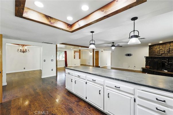 Empty room, Fireplace, Interior, Pendant Lights, Recessed Lighting, Stone Walls, Wood Texture Flooring