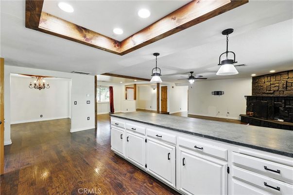 Empty room, Fireplace, Interior, Pendant Lights, Recessed Lighting, Stone Walls, Wood Texture Flooring