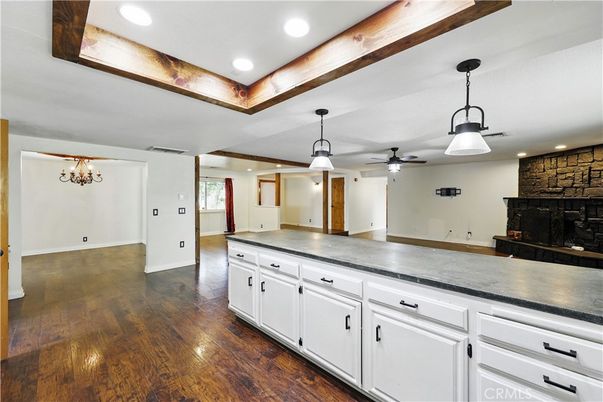 Empty room, Fireplace, Interior, Pendant Lights, Recessed Lighting, Stone Walls, Wood Texture Flooring