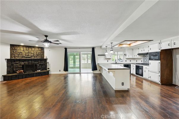 Fireplace, Interior, Kitchen, Pendant Lights, Recessed Lighting, Stone Walls, Wood Texture Flooring