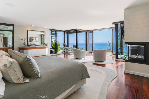 Bedroom, Fireplace, Interior, Recessed Lighting, Water, Wood Texture Flooring
