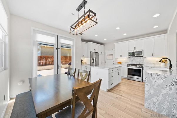 Dining room, Interior, Kitchen, Pendant Lights, Recessed Lighting, Stainless Steel Appliances, Wood Texture Flooring