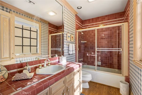 Bathroom, Glass Shower, Interior, Recessed Lighting, Tile Countertops, Wood Texture Flooring
