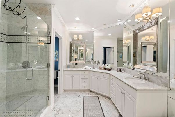 Bathroom, Dual Sink Vanities, Glass Shower, Interior, Marble, Marble Walls, Recessed Lighting