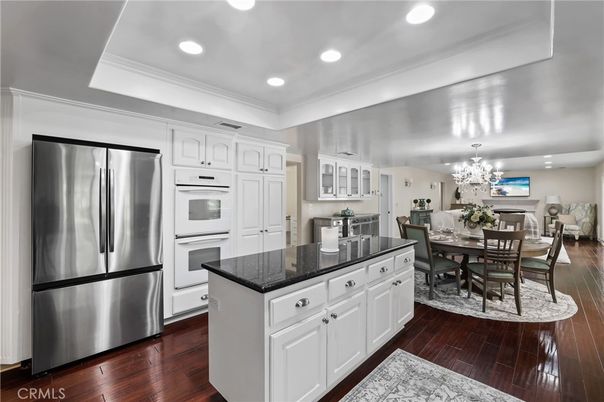 Chandelier, Dining room, Interior, Kitchen, Recessed Lighting, Stainless Steel Appliances, Wood Texture Flooring