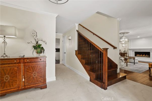 Chandelier, Fireplace, Interior, Marble, Recessed Lighting, Wood Texture Flooring