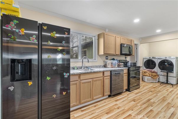 Interior, Kitchen, Recessed Lighting, Washer, Wood Texture Flooring