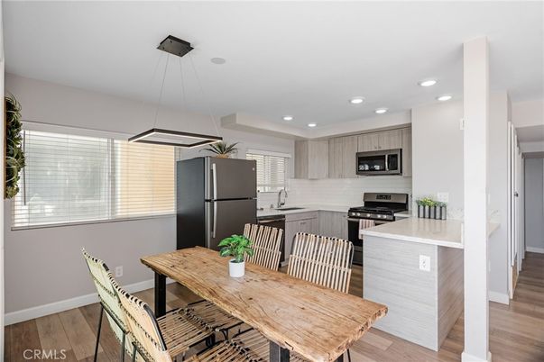 Dining room, Interior, Kitchen, Pendant Lights, Recessed Lighting, Stainless Steel Appliances, Wood Texture Flooring