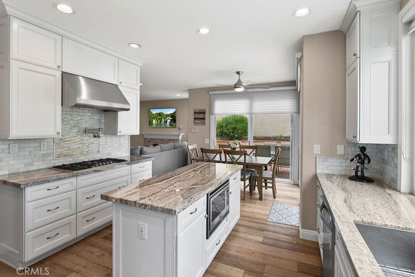 Dining room, Interior, Kitchen, Recessed Lighting, Stainless Steel Appliances, Wood Texture Flooring