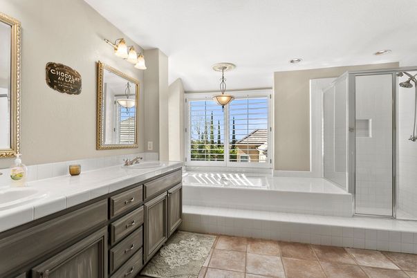 Bathroom, Dual Sink Vanities, Glass Shower, Interior, Pendant Lights, Recessed Lighting, Tile Countertops