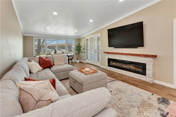 Dining room, Fireplace, Interior, Living room, Recessed Lighting, Wood Texture Flooring
