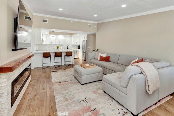 Fireplace, Interior, Kitchen, Living room, Pendant Lights, Recessed Lighting, Stainless Steel Appliances, Wood Texture Flooring