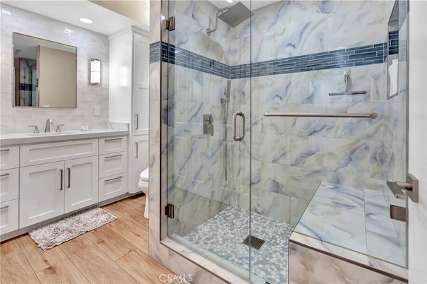 Bathroom, Glass Shower, Interior, Marble Walls, Recessed Lighting, Wood Texture Flooring