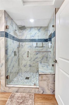Bathroom, Glass Shower, Interior, Marble Walls, Recessed Lighting, Wood Texture Flooring