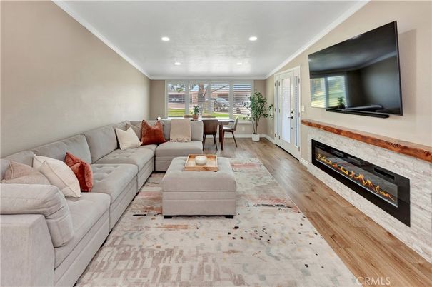 Dining room, Fireplace, Interior, Living room, Recessed Lighting, Wood Texture Flooring
