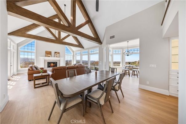 Chandelier, Dining room, Fireplace, Interior, Living room, Pendant Lights, Wooden Beams, Wood Texture Flooring