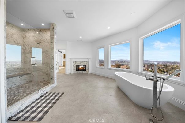Bathroom, Fireplace, Free Standing Baths, Glass Shower, Interior, Marble Walls, Recessed Lighting
