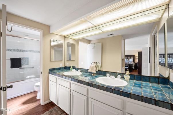 Bathroom, Dual Sink Vanities, Interior, Tile Countertops, Wood Texture Flooring