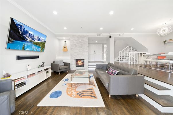 Dining room, Fireplace, Interior, Living room, Pendant Lights, Recessed Lighting, Stone Walls, Wood Texture Flooring