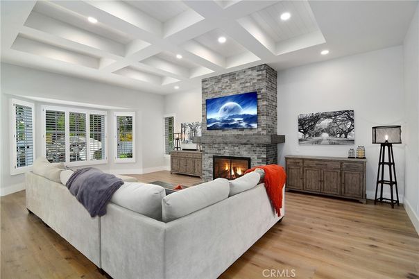Fireplace, Interior, Living room, Recessed Lighting, Stone Walls, Wood Texture Flooring
