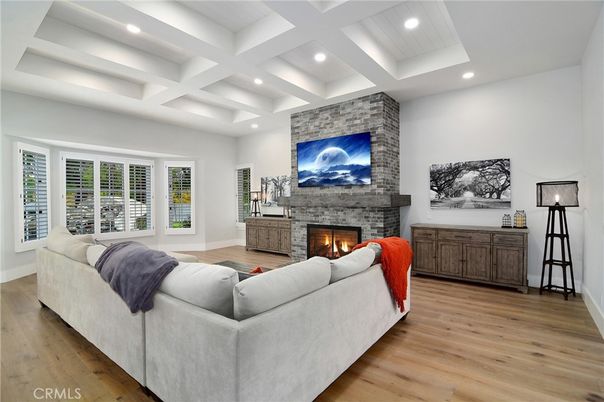 Fireplace, Interior, Living room, Recessed Lighting, Stone Walls, Wood Texture Flooring