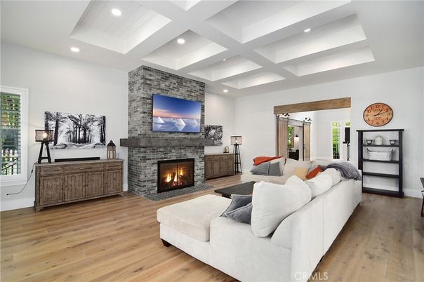 Fireplace, Interior, Living room, Recessed Lighting, Stone Walls, Wood Texture Flooring