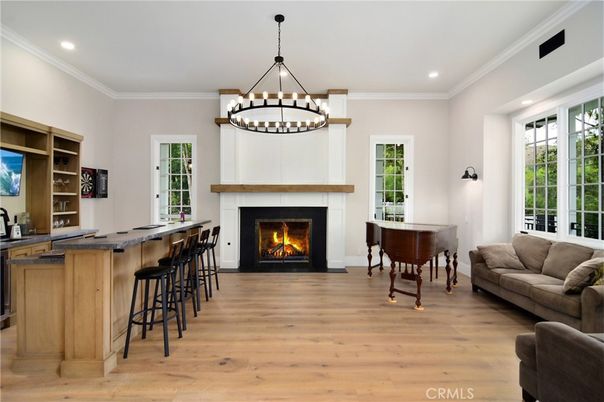 Chandelier, Fireplace, Interior, Pendant Lights, Piano, Recessed Lighting, Wood Texture Flooring
