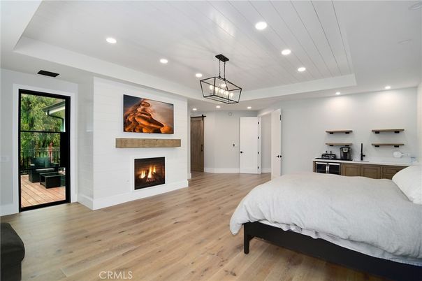 Bedroom, Fireplace, Interior, Pendant Lights, Recessed Lighting, Wood Texture Flooring